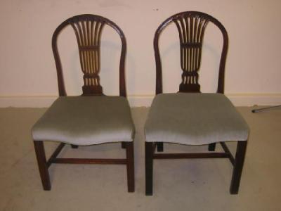 Appraisal: A PAIR OF GEORGE III SIDE CHAIRS the hooped back