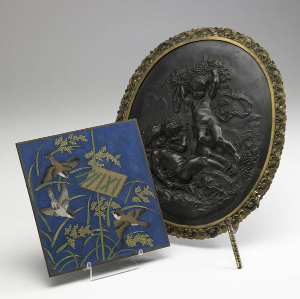 Appraisal: BRONZE PLAQUE Oval with relief cherubs in brass frame together