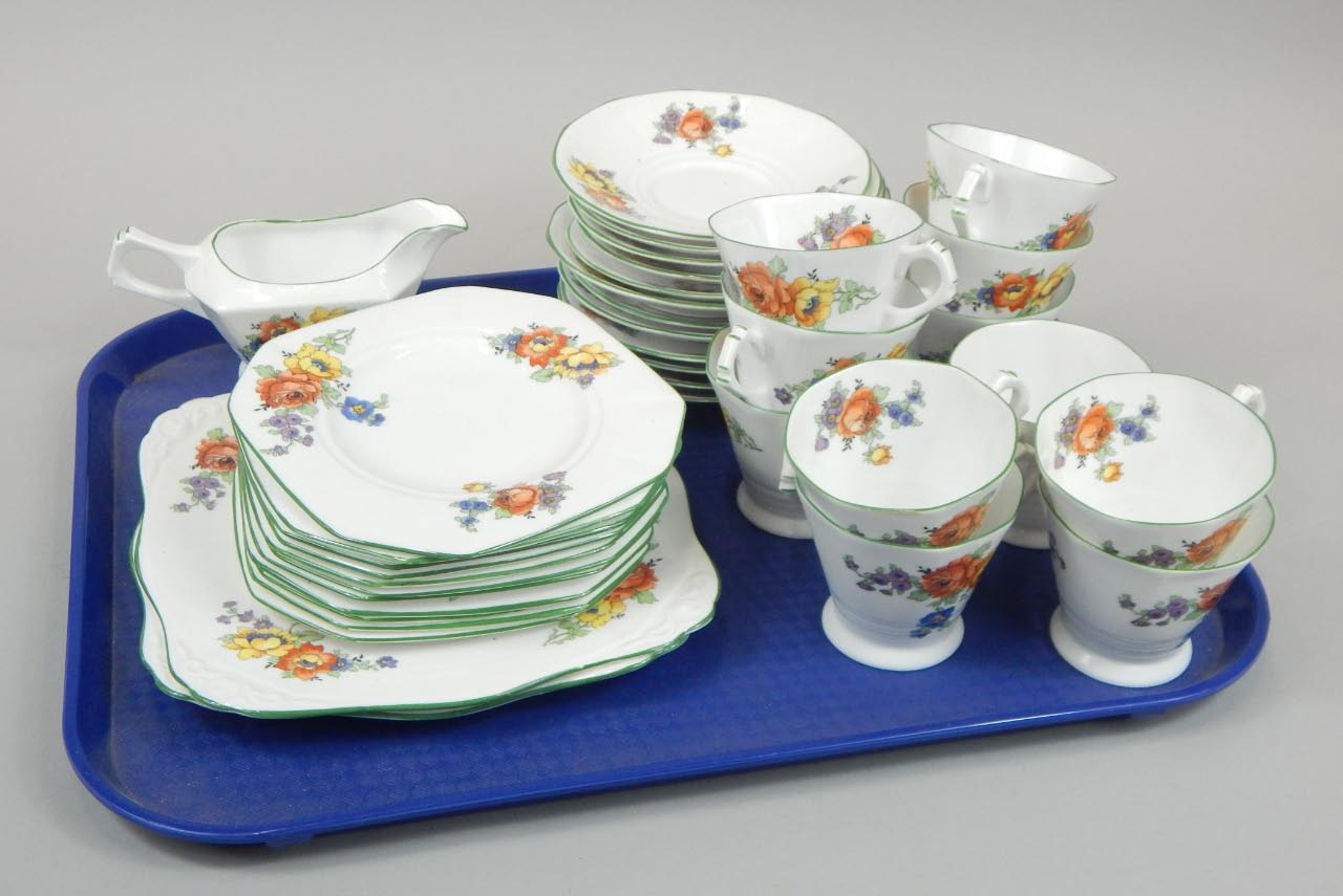 Appraisal: A Tuscan china Art Deco style part tea set each