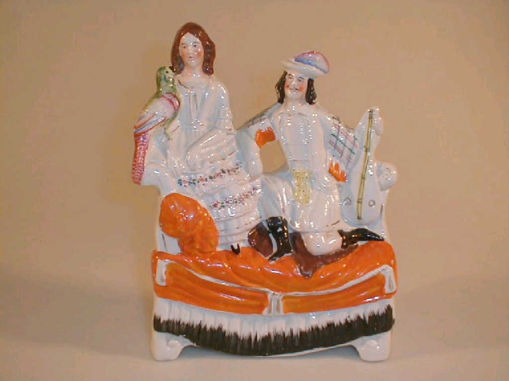 Appraisal: A thC Staffordshire Pottery flat back figure group modelled as