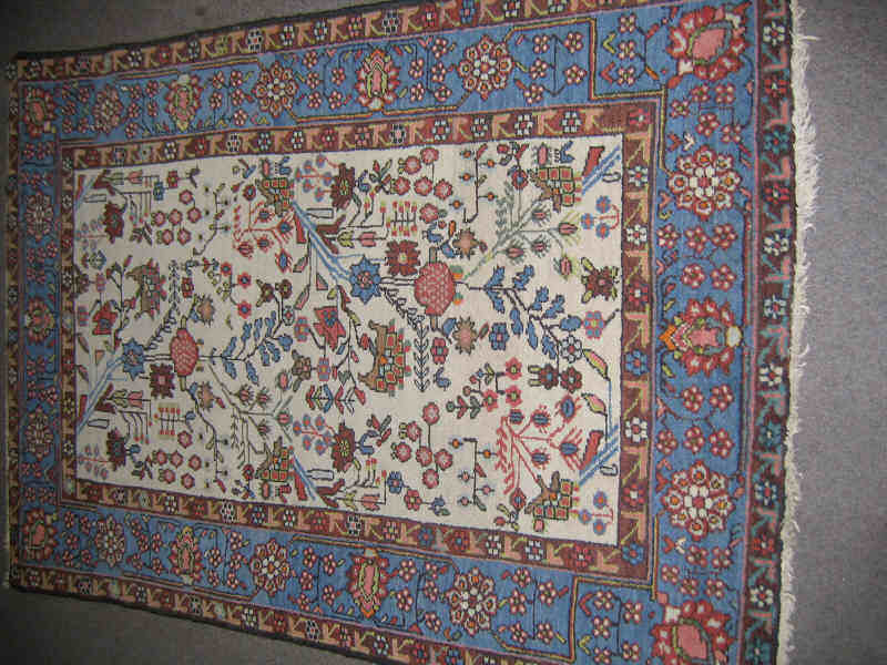 Appraisal: HAMADAN THROW RUG The ivory field with allover angular floral