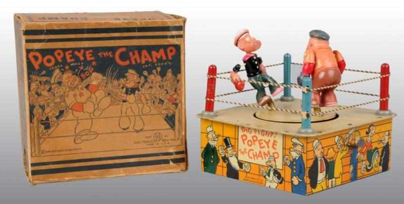 Appraisal: Celluloid Tin Marx Popeye the Champ Wind-Up Toy Description American