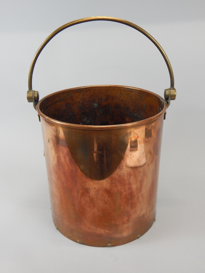 Appraisal: A thC riveted copper and brass coal bucket with swivel