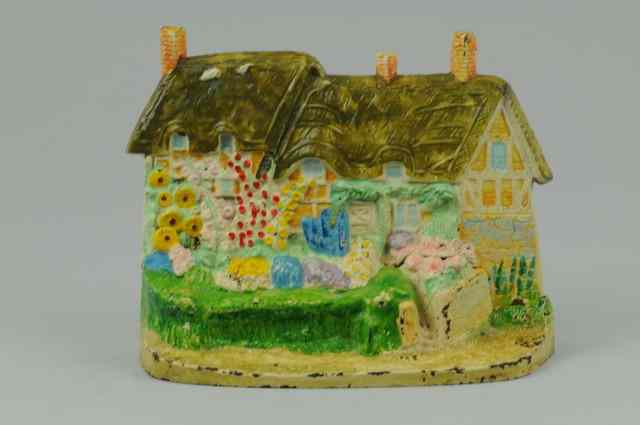 Appraisal: ANN HATHAWAY COTTAGE DOORSTOP Hubley incredible two piece mold design