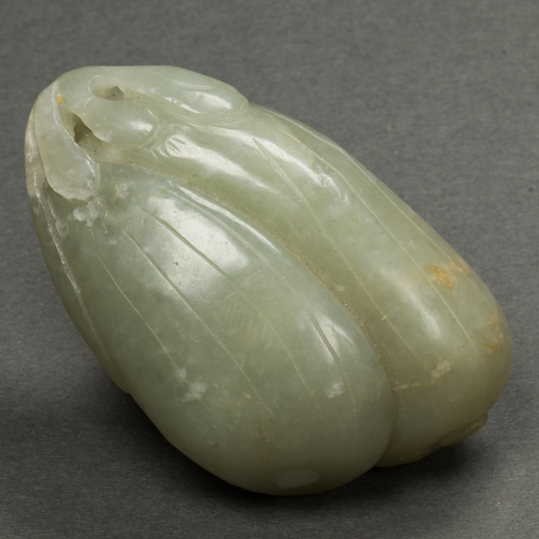 Appraisal: CHINESE CELADON JADE 'MELON' TOGGLE Chinese celadon jade 'melon' toggle