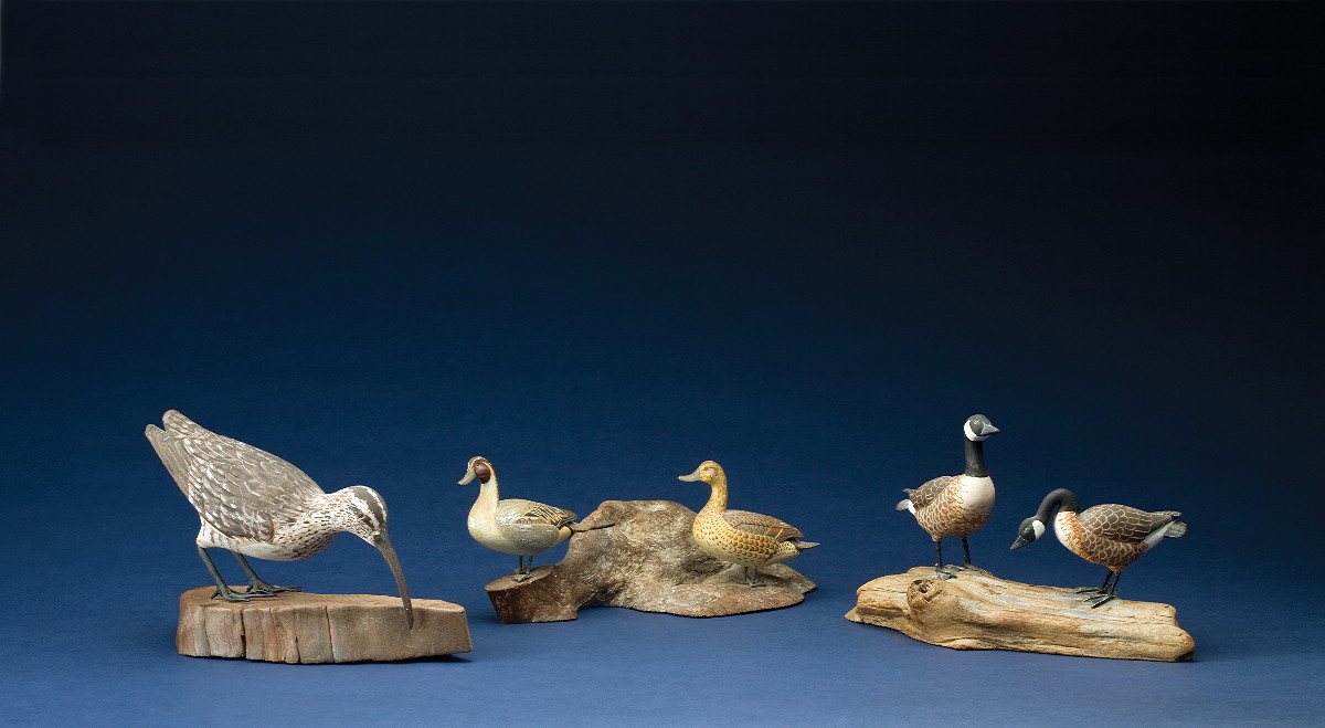 Appraisal: PAIR OF MINIAUTRE CANADA GEESE ON A DRIFTWOOD BASE Stamped