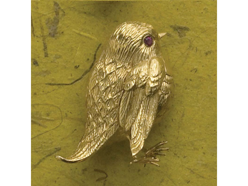 Appraisal: YELLOW GOLD BIRD DESIGN BROOCH With melee ruby eye stamped