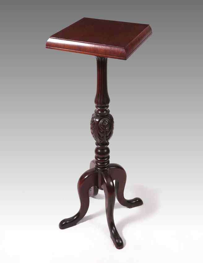 Appraisal: MAHOGANY PLANT STAND Square top over carved and turned body