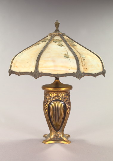 Appraisal: Large American Gilded Metal and Floral-Painted Caramel Slag Glass Vasiform