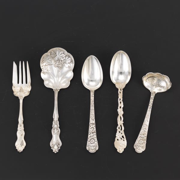 Appraisal: FIVE SILVER SERVING UTENSILS Including tablespoon with grapevine handle by