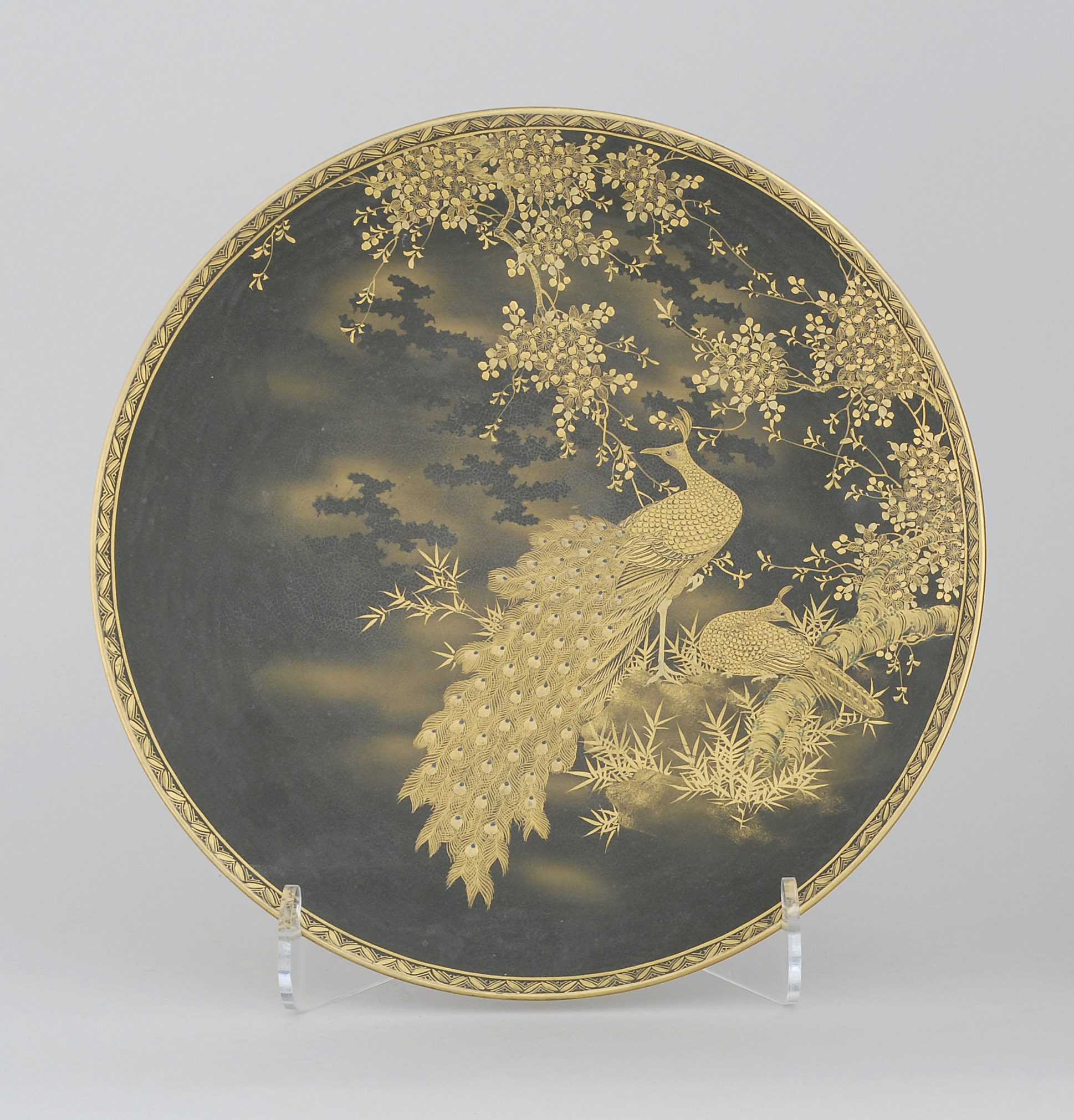 Appraisal: SATSUMA POTTERY CHARGER Meiji PeriodBy Seizan With golden peacock design