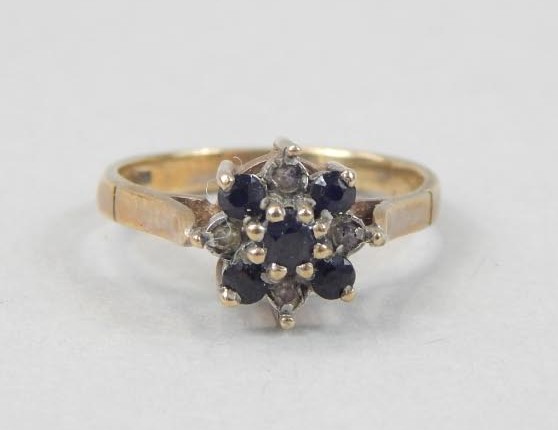 Appraisal: A ct gold dress ring set with garnet and small