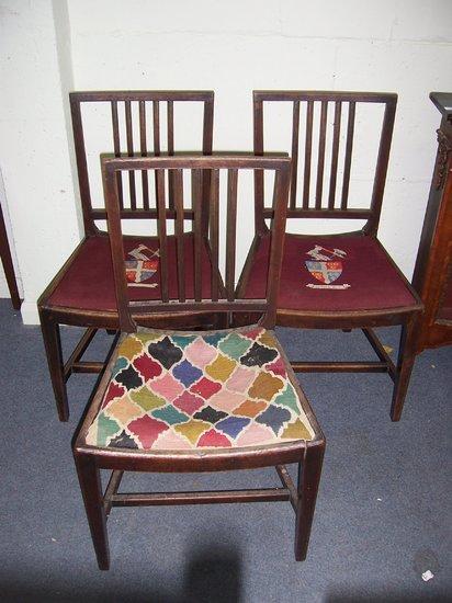 Appraisal: A pair of mahogany framed dining chairs the trap seats