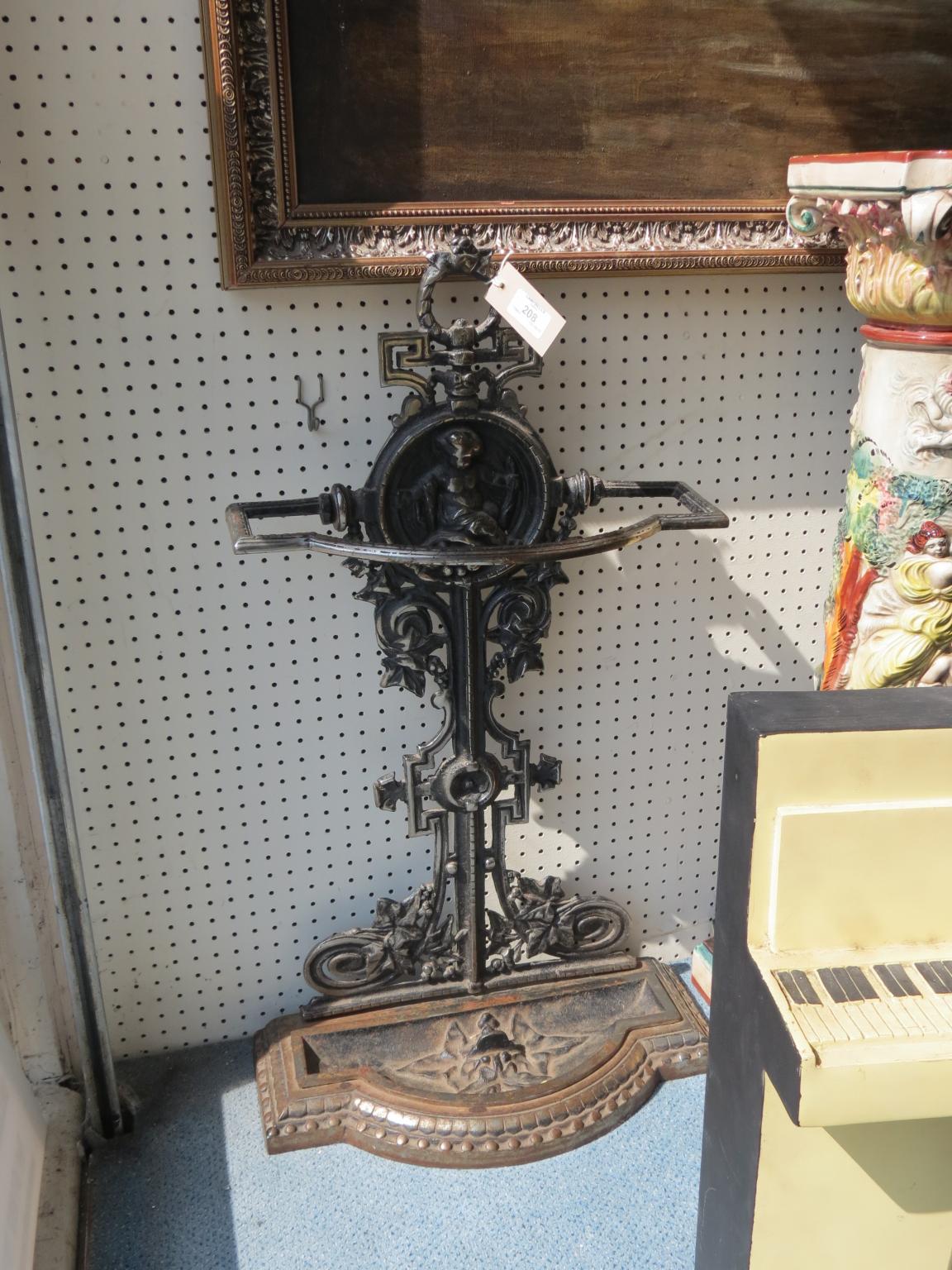 Appraisal: A late Victorian cast iron stick-stand with drip-tray in high