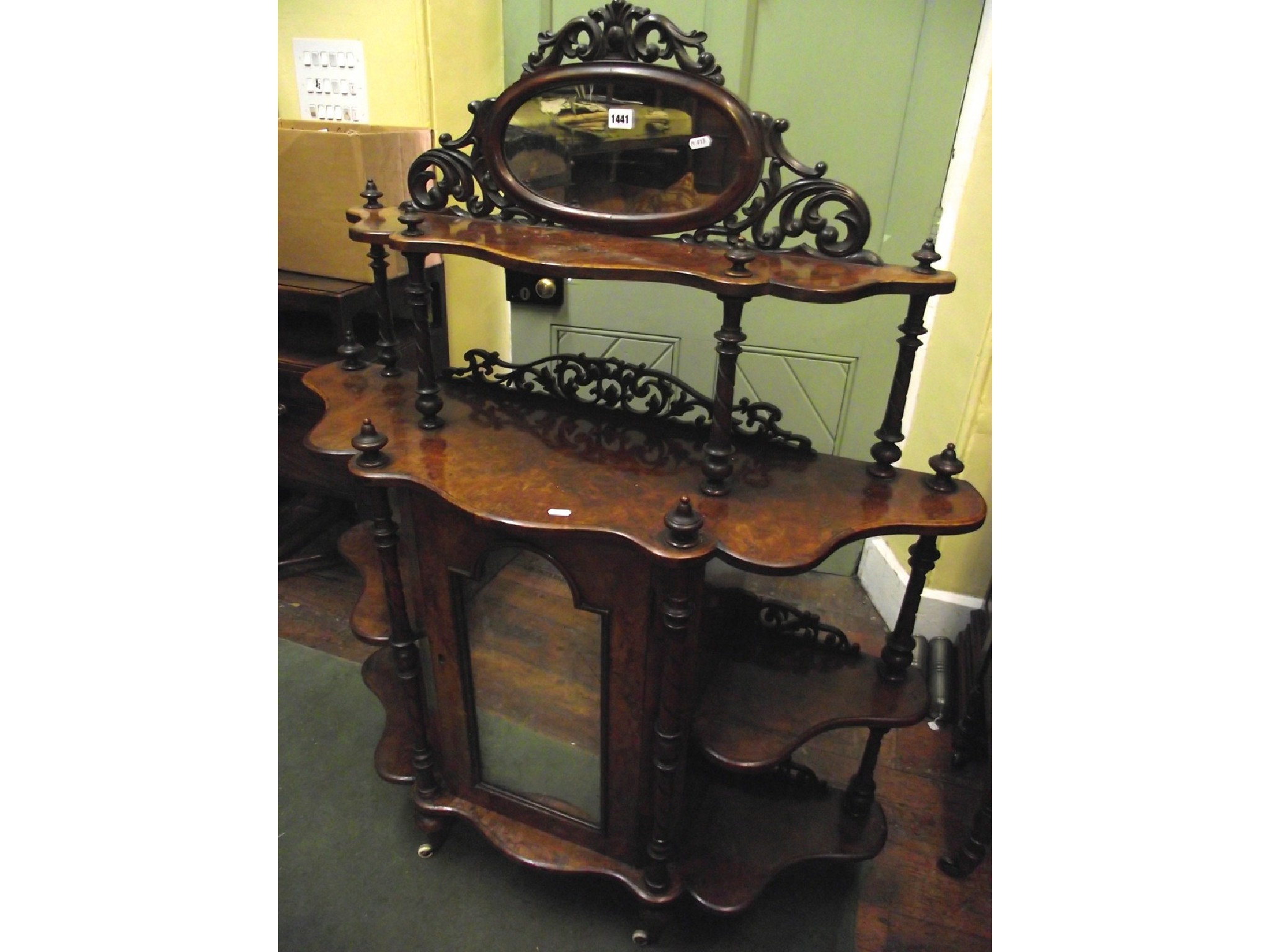 Appraisal: A mid Victorian burr walnut whatnot raised on four tiers