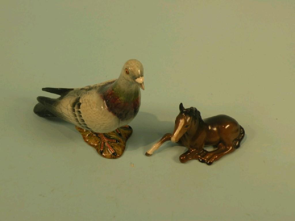 Appraisal: A Beswick pigeon No and a seated foal