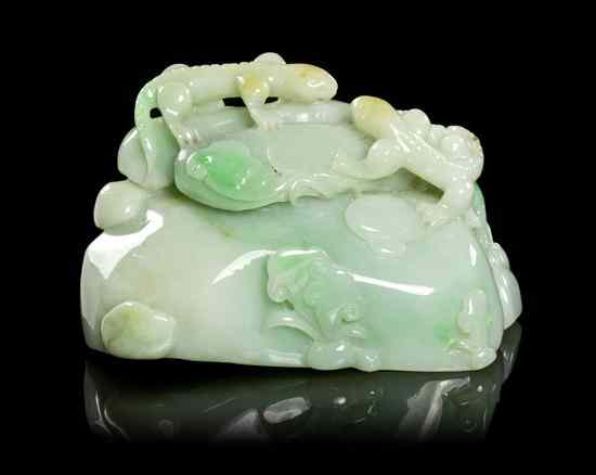 Appraisal: A Jadeite Carving of Lizards on a Boulder having apple