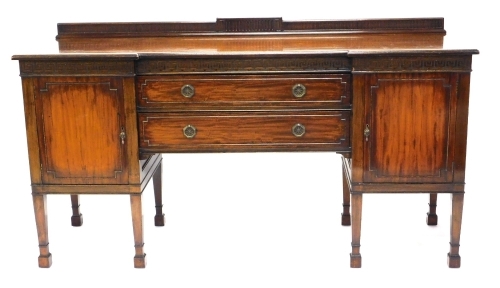 Appraisal: An Edwardian mahogany inverted breakfront sideboard with a raised back