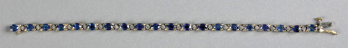 Appraisal: K yellow gold tennis bracelet with oval pale blue sapphires