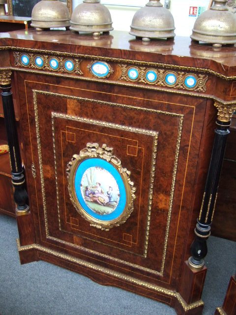 Appraisal: A pair of Louis XVI style walnut side cabinets with