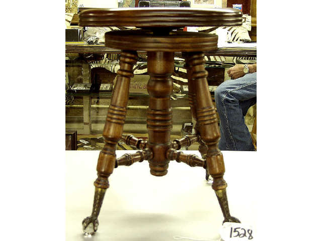 Appraisal: Glass ball and claw footed adjustable piano stool circa -