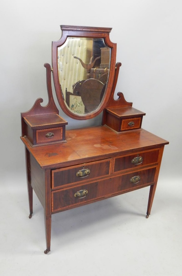 Appraisal: An Edwardian mahogany and satinwood banded dressing table with a