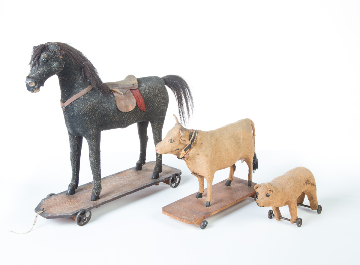 Appraisal: THREE PULL TOYS American th quarter- th century Horse with