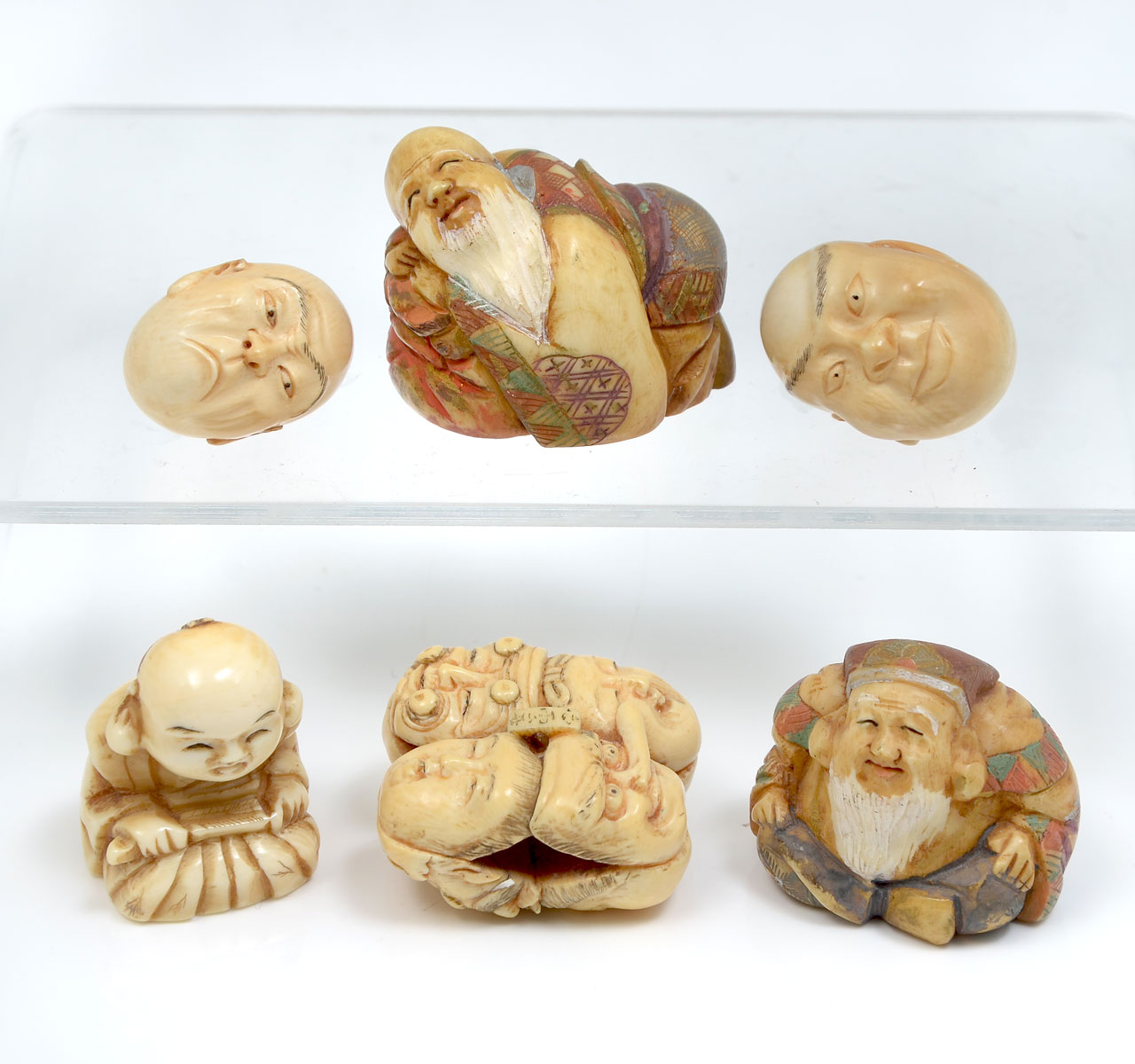 Appraisal: PC CARVED IVORY NETSUKE MASK HEAD COLLECTION - carved Japanese