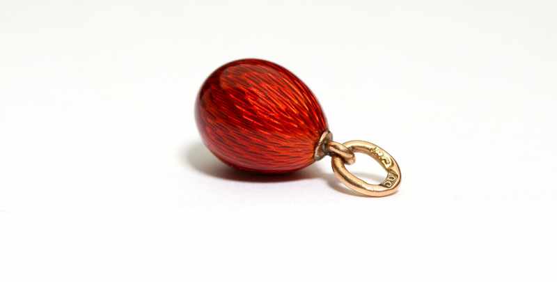 Appraisal: A Faberge red guilloche egg pendant K yellow gold marked