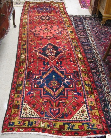 Appraisal: PERSIAN AZAR CORRIDOR RUG hand knotted in a design comprising