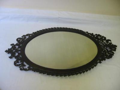 Appraisal: A VICTORIAN MAHOGANY FRET FRAMED PIER GLASS of oval form