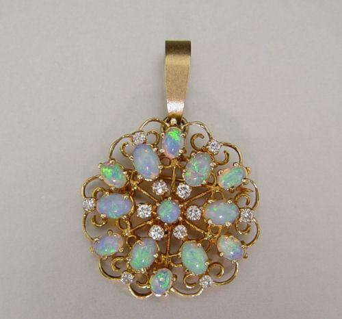 Appraisal: k OPAL AND DIAMOND PENDANT BROOCH K yellow gold snowflake