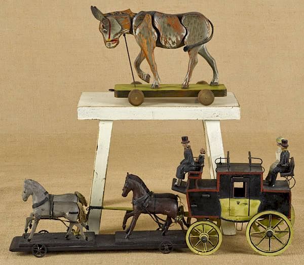 Appraisal: Wood horse drawn pull toy with carriage and figur Wood