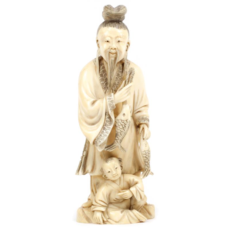 Appraisal: Chinese carved ivory figure group Elder with child and fish