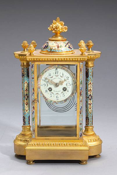 Appraisal: A French gilt bronze and champlev enamel four glass regulator