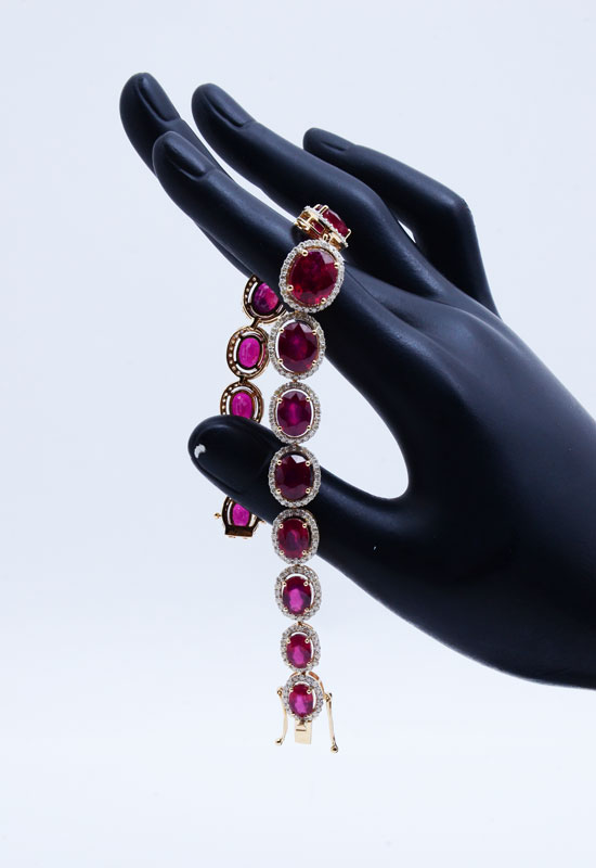 Appraisal: K CTW RUBY AND DIAMOND BRACELET oval mixed cut natural