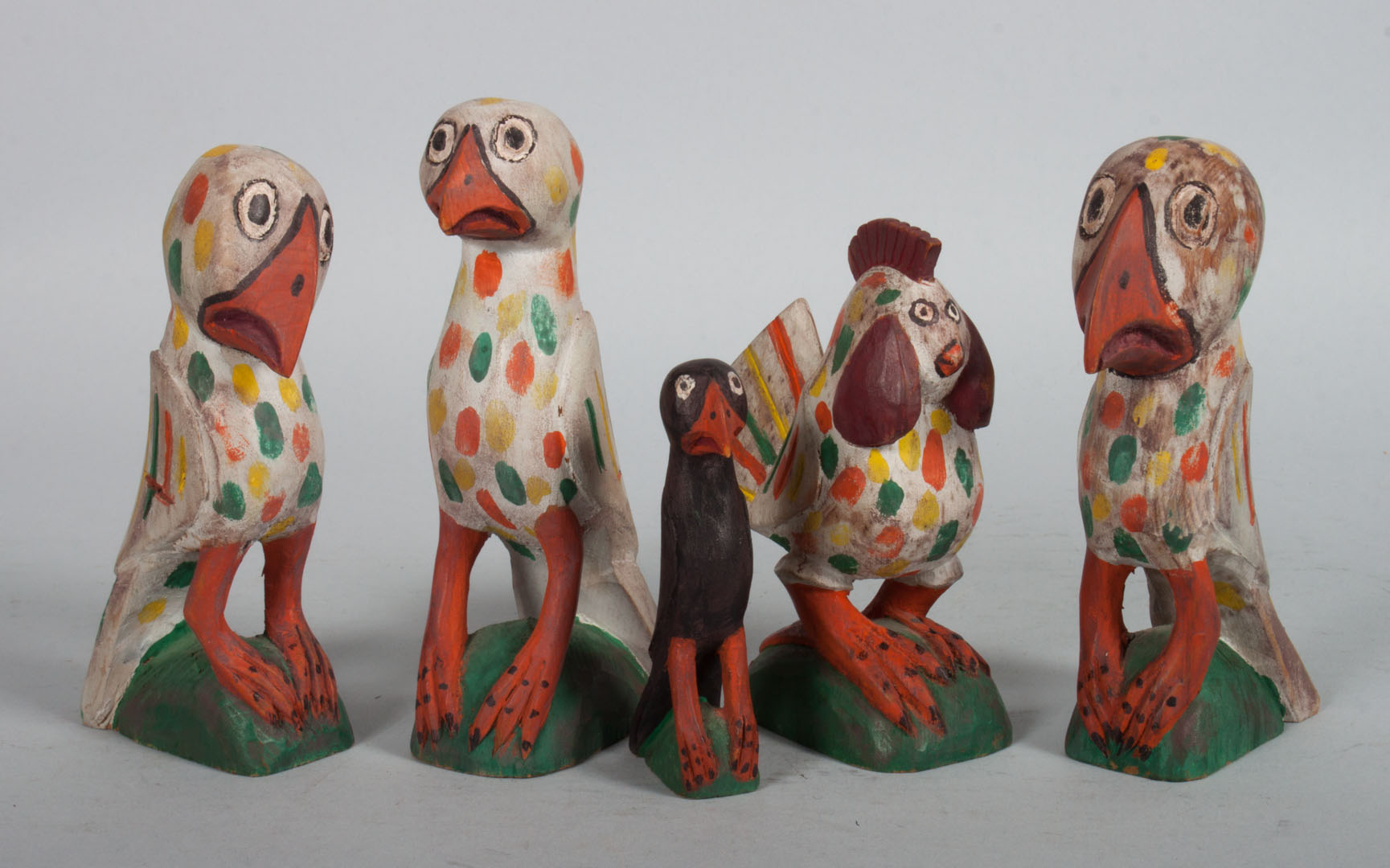 Appraisal: contemporary folk art bird figures folk art carved and polychromed