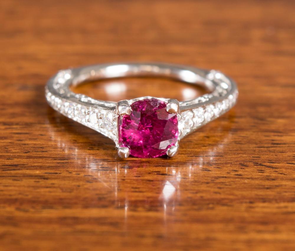 Appraisal: RITANI PLATINUM DIAMOND AND RUBY RING with bezel and prong