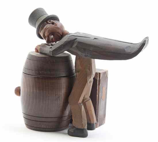 Appraisal: A German Carved Wood Figural Musical Humidor depicting a man