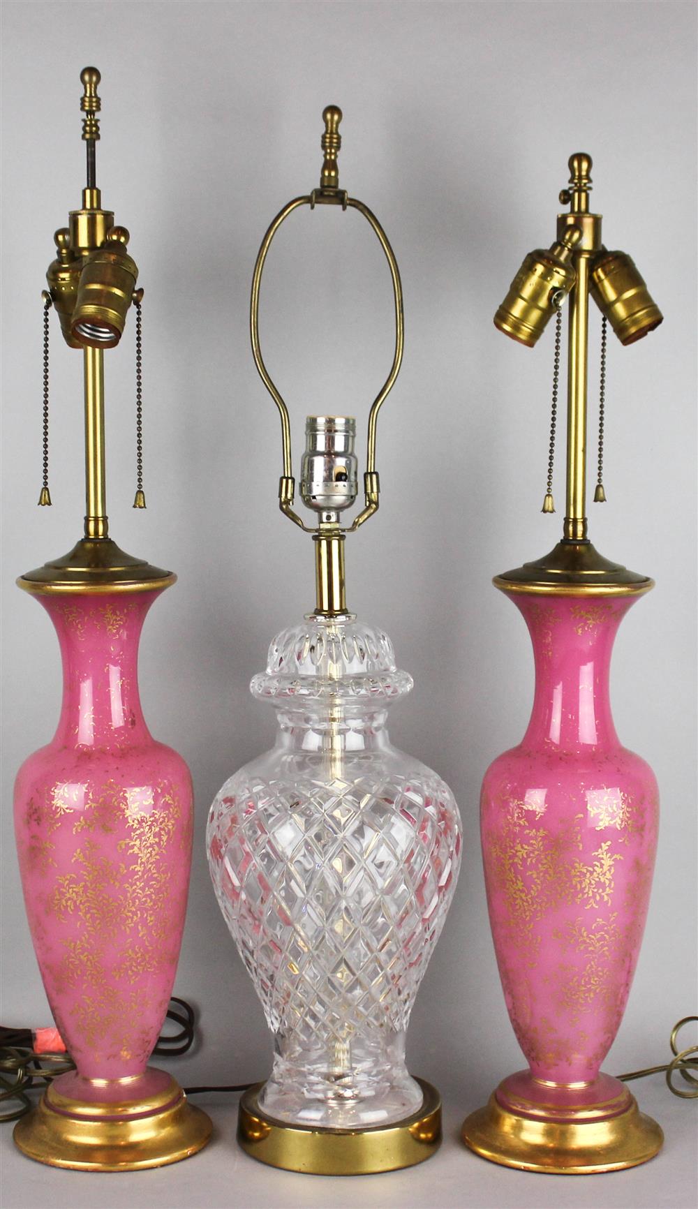 Appraisal: PAIR OF CONTINENTAL GILT-ENRICHED PINK GLASS VASES NOW MOUNTED AS