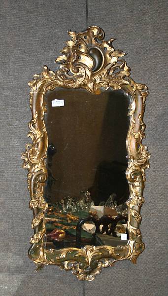 Appraisal: A Rococo style parcel gilt and painted mirror height in