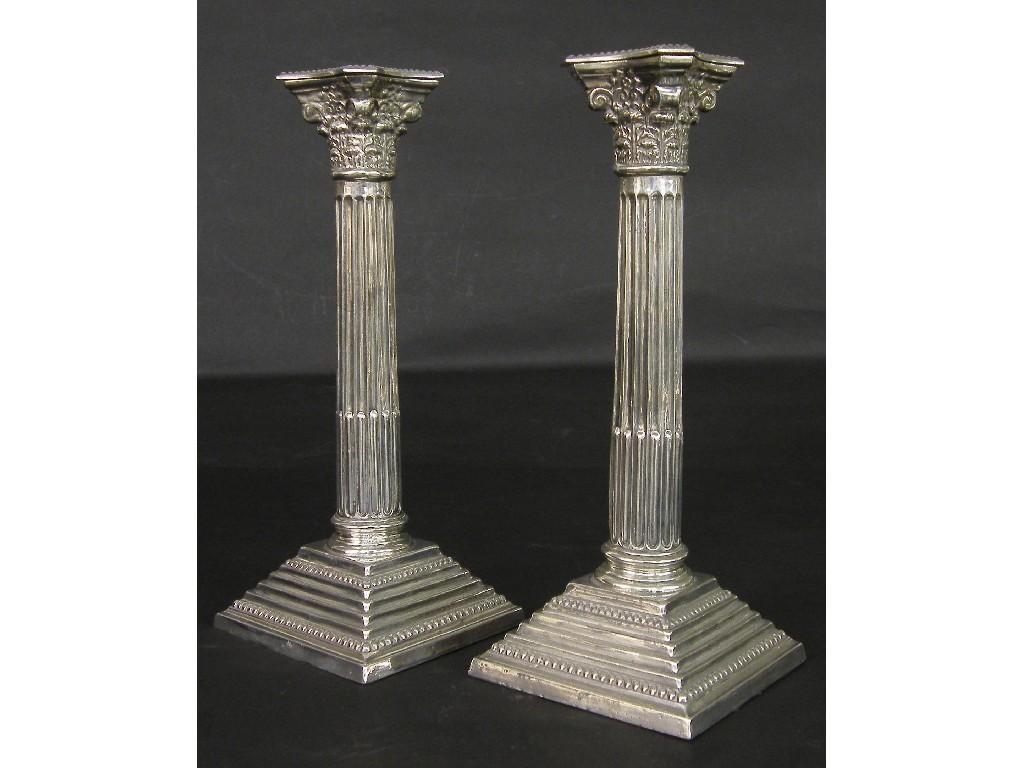 Appraisal: Pair of s Neoclassical style silver candlesticks the beaded rim