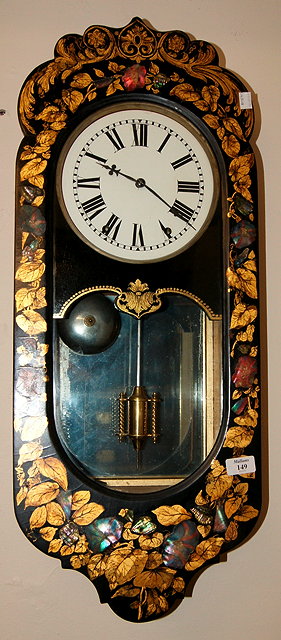 Appraisal: A Victorian black papier mache lacquer wall clockwith white enamelled