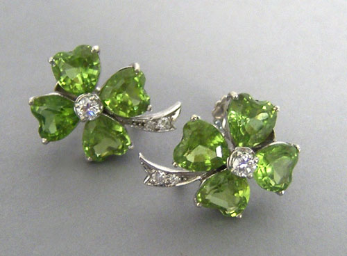 Appraisal: K white gold peridot and diamond earrings each with four