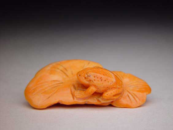 Appraisal: CORAL NETSUKE TOGGLE Well carved coral netsuke toggle of a