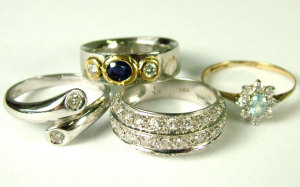 Appraisal: Four gold and gem set rings to include A platinum