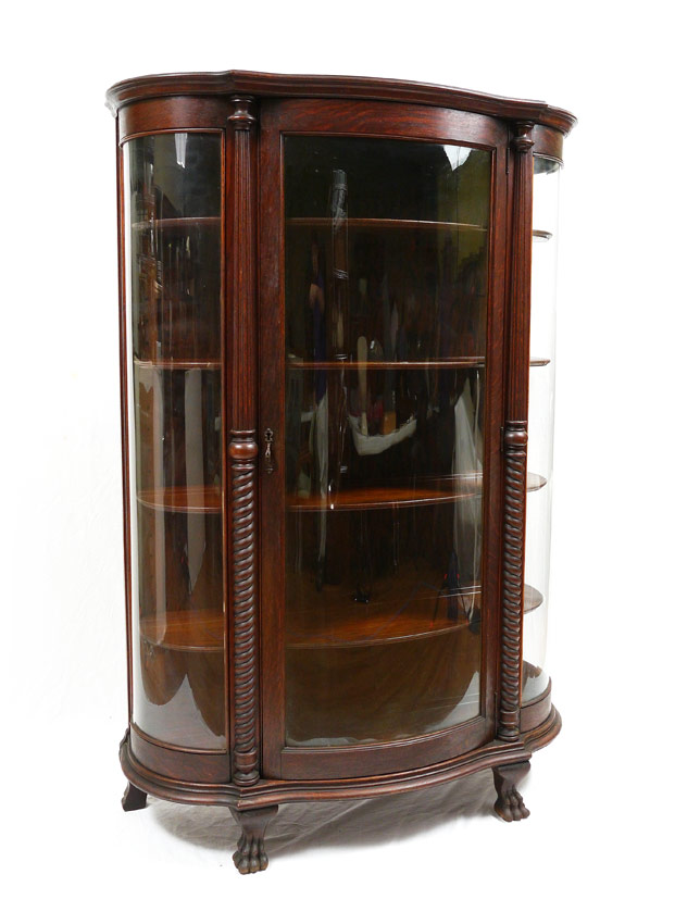 Appraisal: TIGER OAK TRIPLE BOW CHINA CABINET Shaped front with triple