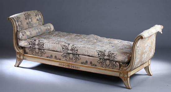 Appraisal: DIRECTOIRE PAINTED AND PARCEL-GILT SLEIGH-FORM DAYBED th century Side-scrolling padded