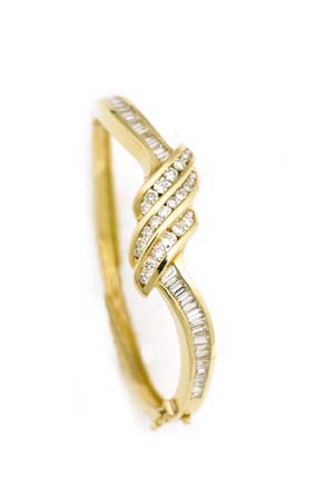 Appraisal: DIAMOND AND YELLOW GOLD BRACELET Diamond and yellow gold bangle