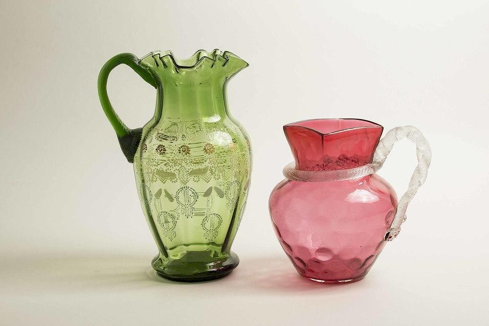 Appraisal: Two Glass Pitchers Two glass pitchers comprising a cranberry glass